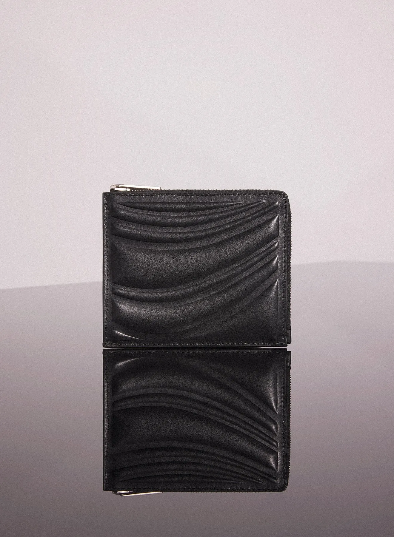 black embossed spiral wallet