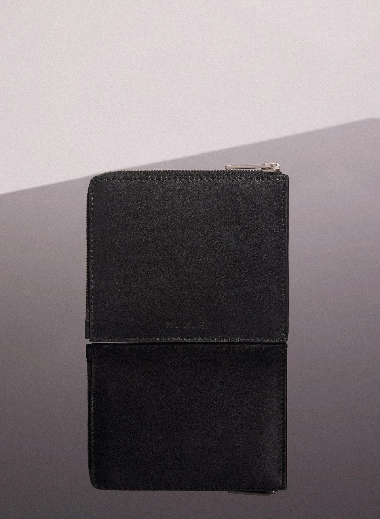 black embossed spiral wallet