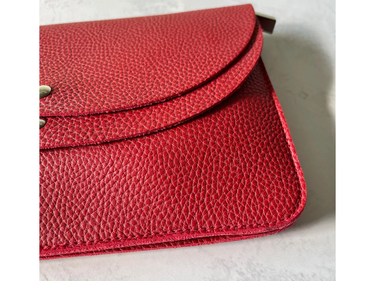 RED ENVELOPE MULTI-POCKET CLUTCH BAG WITH WRISTLET AND LONG SHOULDER STRAP